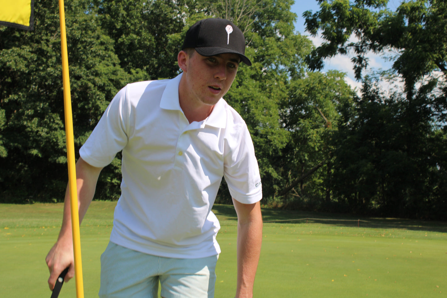 You're Rolled Classic White hat — full body side view on golf course