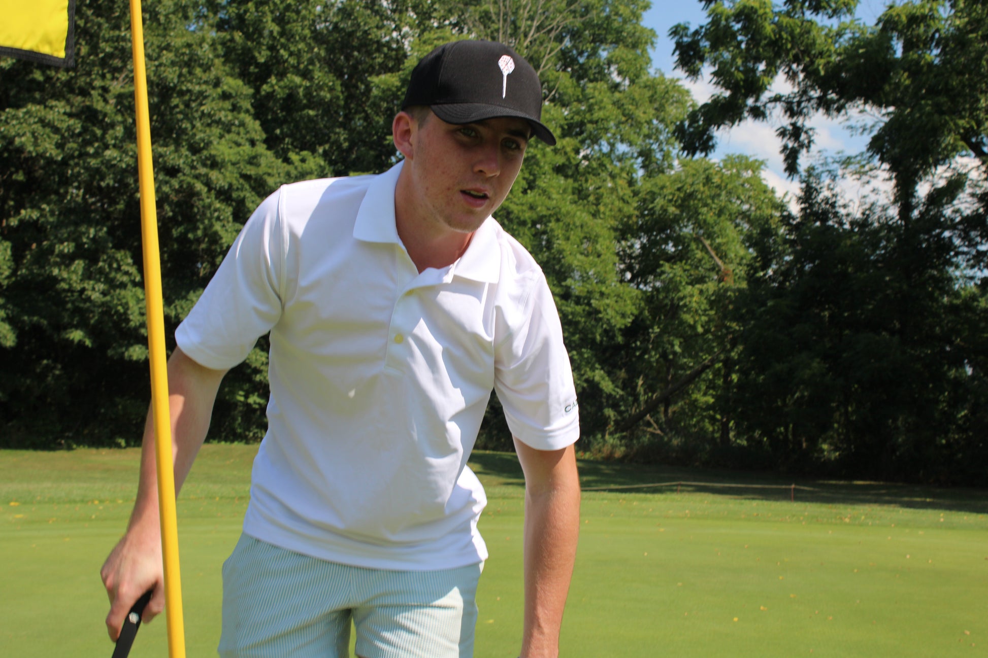 You're Rolled Classic White hat — full body side view on golf course
